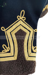 Close-up of embroidered detailing on a Scottish military jacket, highlighting intricate gold designs.